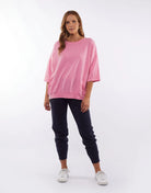 The Super Pink Fundamental Mazie Sweat by Elm is available at Rawspice Boutique.