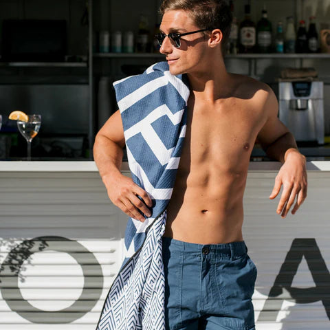 The Ultimate Beach Towel - The Surfers by Sky Gazer is available at Rawspice Boutique.