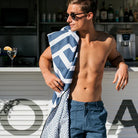 The Ultimate Beach Towel - The Surfers by Sky Gazer is available at Rawspice Boutique.