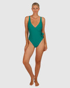 A woman modelling the Rococco D-DD Cup Surplice One Piece Swimming Costume in Jungle