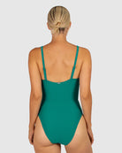 A woman modelling the Rococco D-DD Cup Surplice One Piece Swimming Costume in Jungle from behind