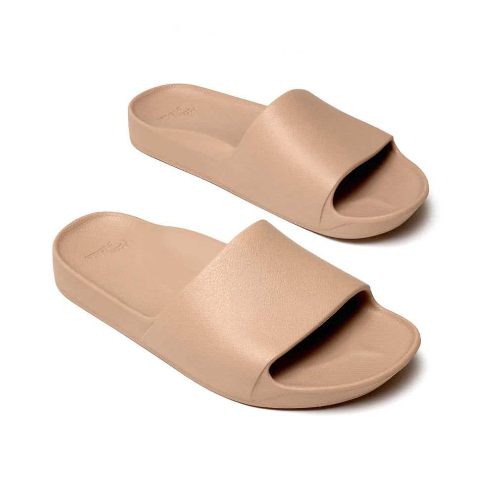 The Tan Arch Support Slides by Archies are available at Rawspice Boutique.