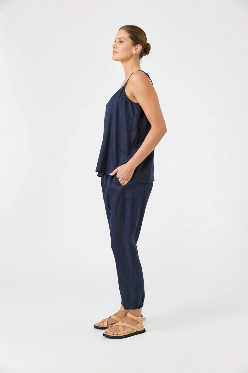Studio Tank in navy with square V-neck, adjustable straps, relaxed fit, and soft hem in a lightweight fabric.
