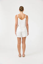 Studio Tank in salt with square V-neck, adjustable straps, relaxed fit, and soft hem in a lightweight fabric.