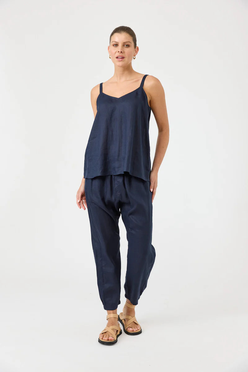 Studio Tank in navy with square V-neck, adjustable straps, relaxed fit, and soft hem in a lightweight fabric.