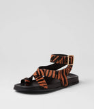  The Huiro Black Tan Zebra Pony Sandals by Mollini are currently available at Rawspice Boutique. 