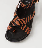  The Huiro Black Tan Zebra Pony Sandals by Mollini are currently available at Rawspice Boutique. 