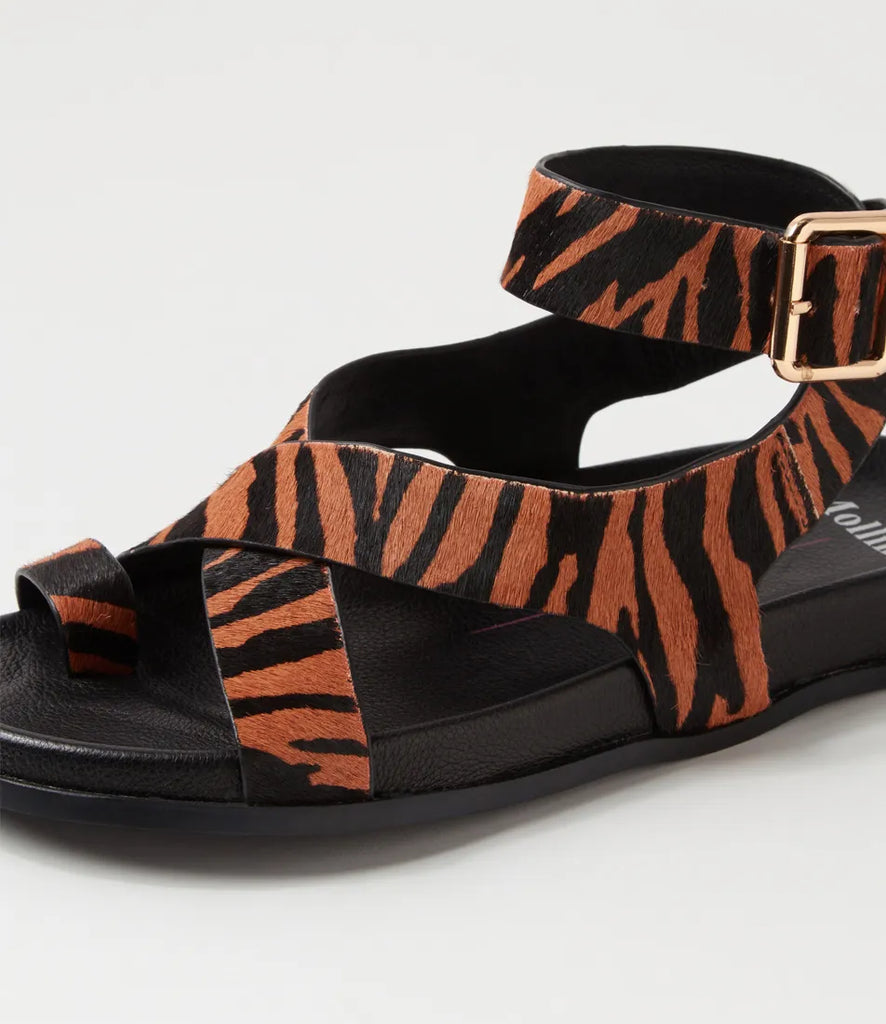  The Huiro Black Tan Zebra Pony Sandals by Mollini are currently available at Rawspice Boutique. 