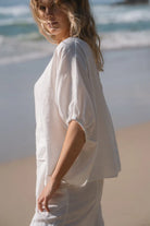 The Ivory Tina Linen Top by Lilly Pilly is available at Rawspice Boutique. 