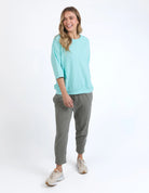 Mazie Sweat in tonic blue with a relaxed oversized fit, 3/4 length sleeves, front pockets, and lightweight 100% cotton fabric.