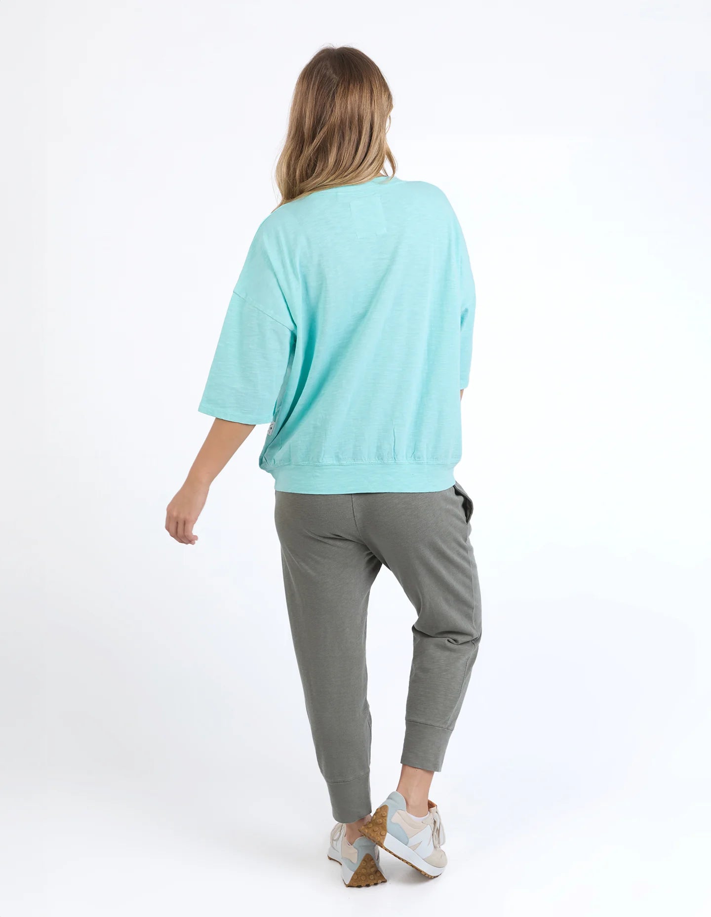 Mazie Sweat in tonic blue with a relaxed oversized fit, 3/4 length sleeves, front pockets, and lightweight 100% cotton fabric.