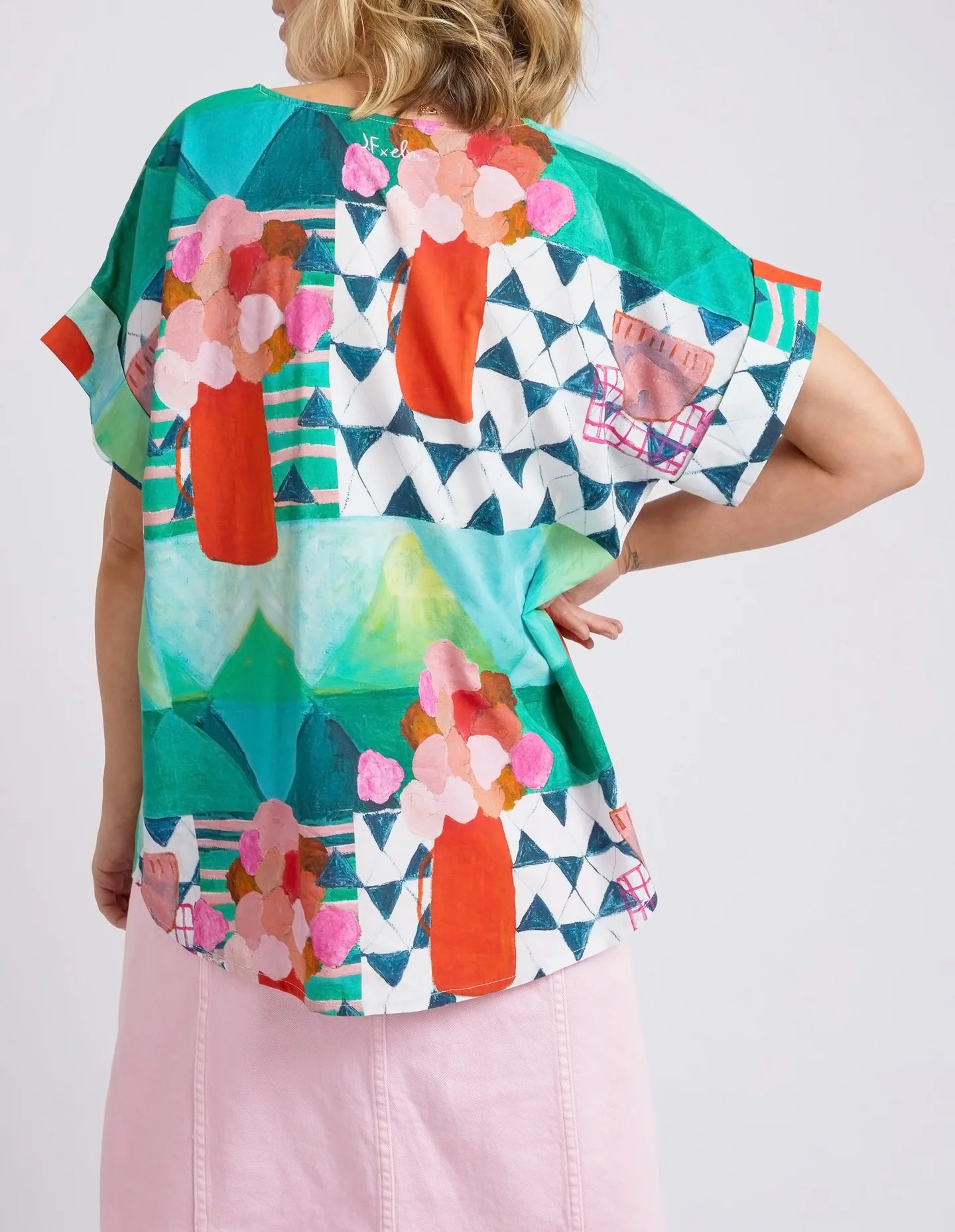 The All Over Green Print Private Universe Top by Elm Clothing is available at Rawspice Boutique.