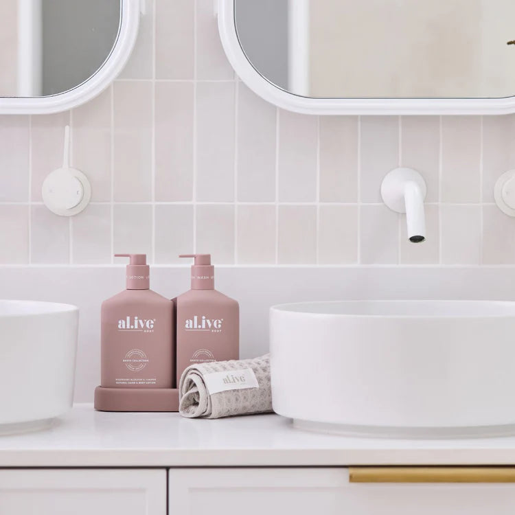 A display of The A Moment To Bloom Hand Wash & Hand Lotion set by al.ive in bathroom