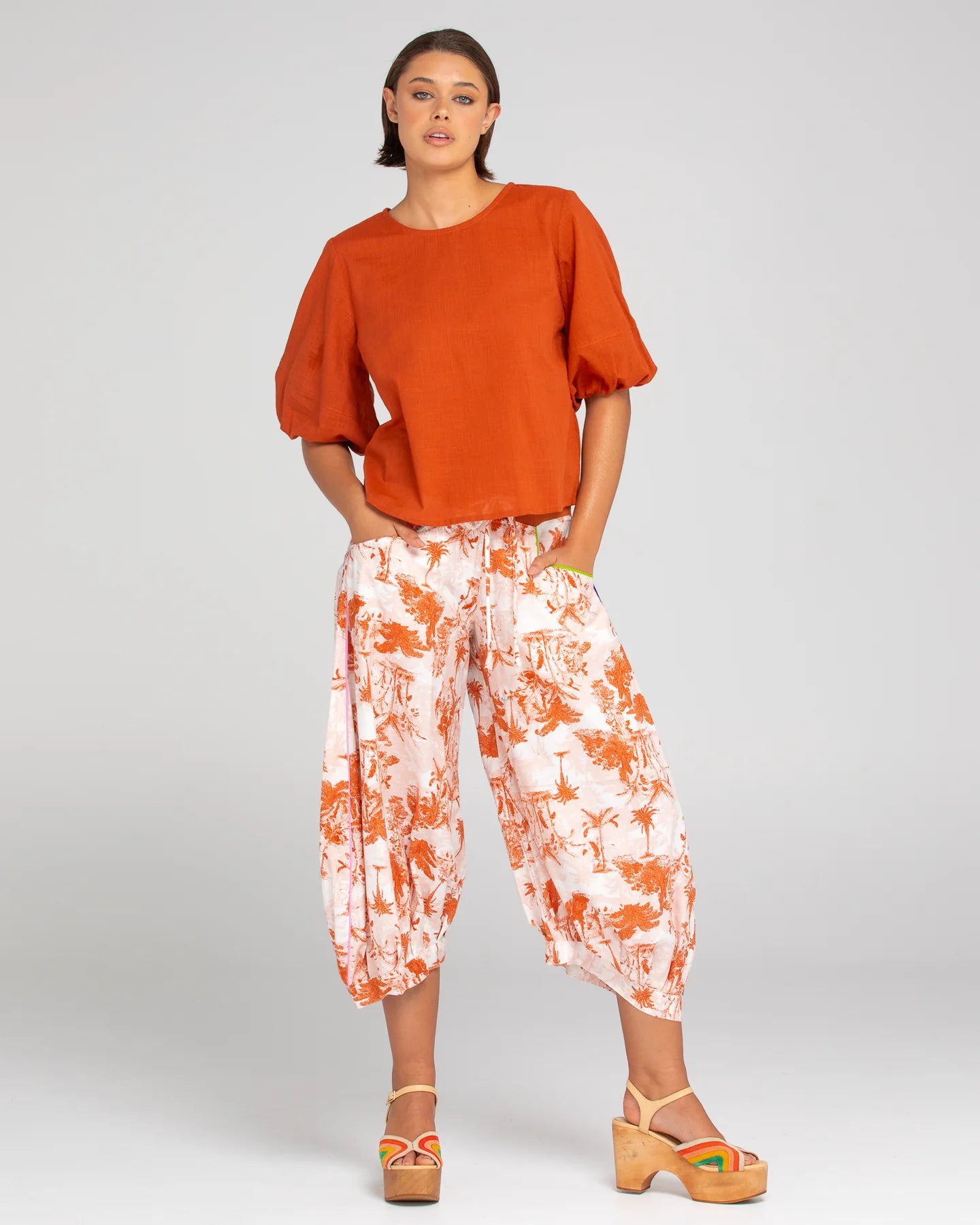 A woman modelling the Boom Shankar Guru Pants in Western Palm print