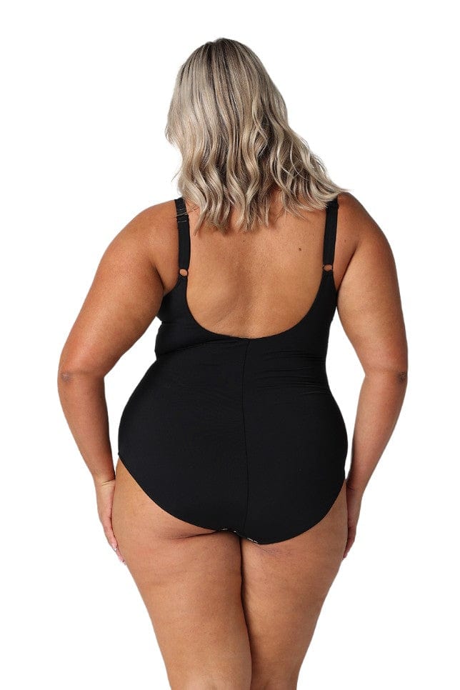 A woman modelling plus size swim wear in the Wildflowers Chlorine Resistant Tank One Piece