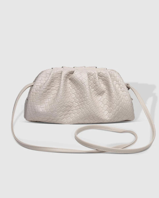 The Macy Woven Clutch by LOUENHIDE is currently available at Rawspice Boutique.