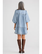 Mini dress featuring a mock neck collar with attached neck tie, 3/4 length balloon sleeves, contrast twin needle seam stitching, and a mini length silhouette.