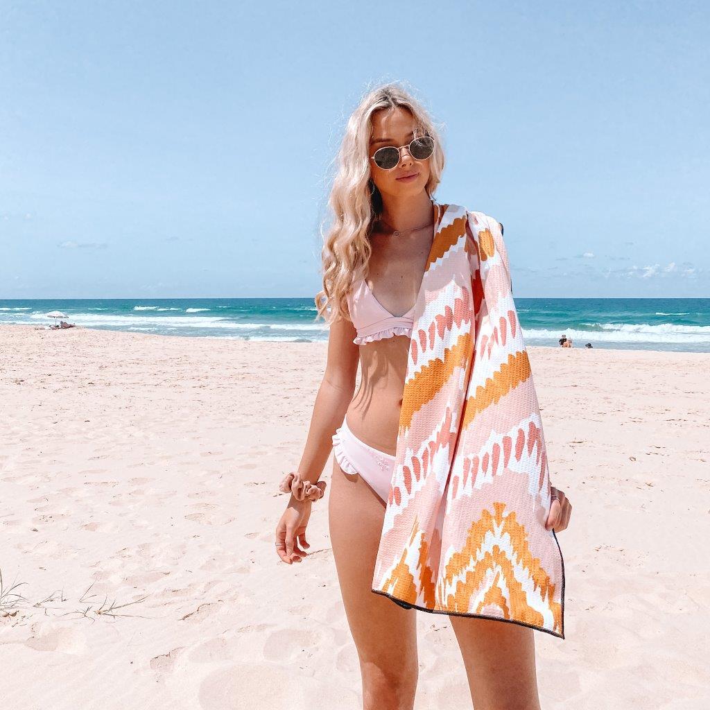 The Airlie The Ultimate Beach Towel - by Sky Gazer currently available at Rawspice Boutique. 