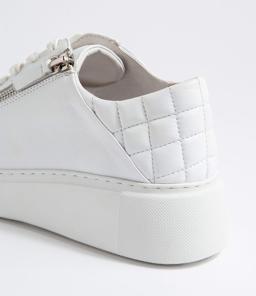 Yurke White Leather Sneakers by Django & Juliette are available at Rawspice Boutique 
